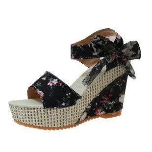 Women's floral wedge sandals with peep toe and ankle strap in pink, black, or blue.