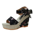 Women's floral wedge sandals with peep toe and ankle strap in pink, black, or blue.