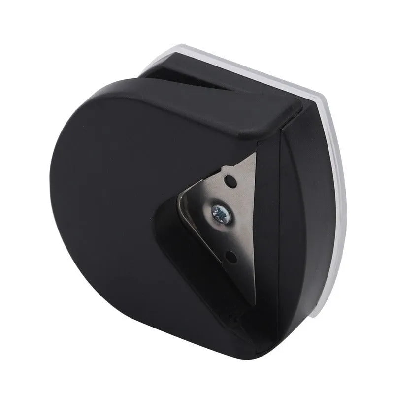 Black plastic and metal business card corner cutter on a white background.