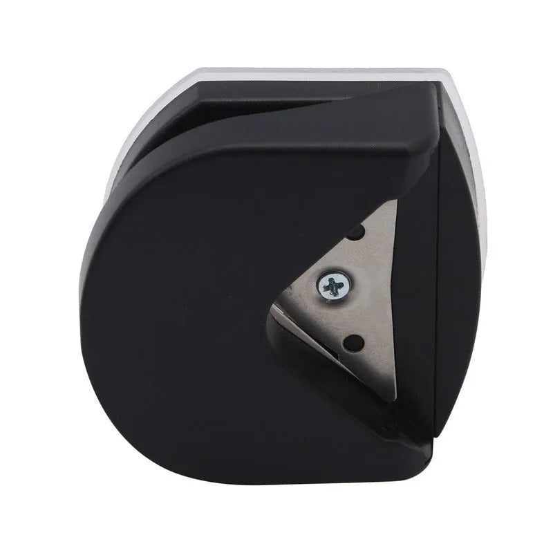 Black plastic and metal business card corner cutter on a white background.