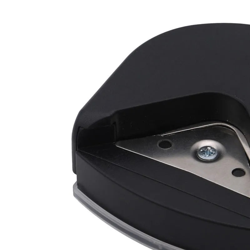 Black plastic and metal business card corner cutter on a white background.