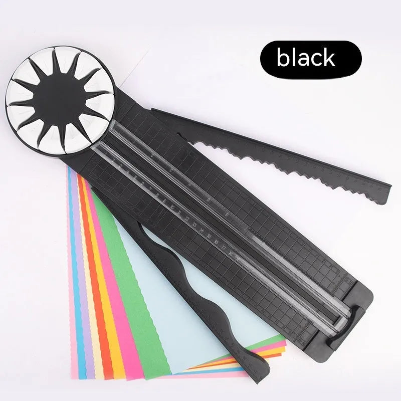 Pink and black 12-in-1 decorative edge paper cutting machine for A4 paper on a desk.