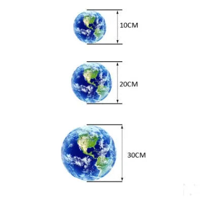 Glow in the dark 3D planet Earth wall sticker in various sizes on a blue wall