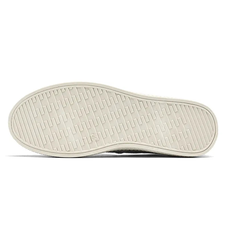 Men's beige canvas slip-on shoes with round toe and PVC sole.
