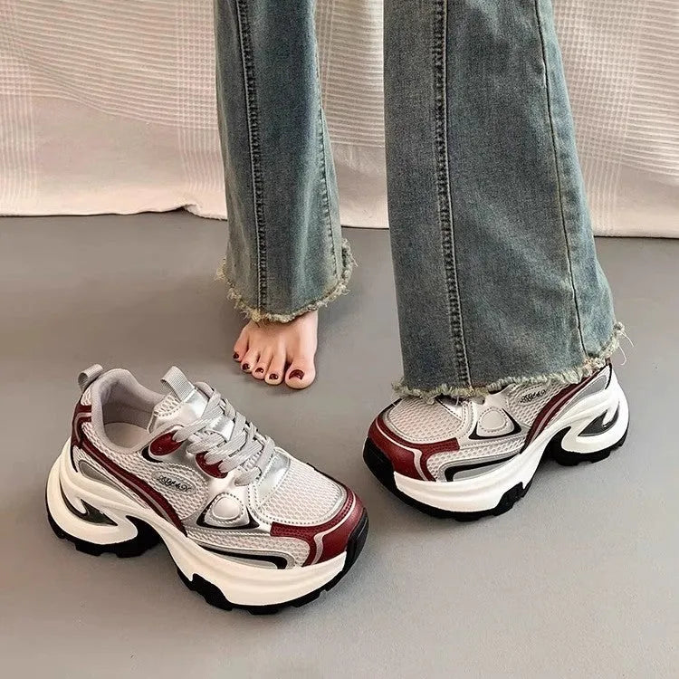Women's silver and red mesh platform sneakers with a rubber sole and lace-up design