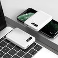 White and black 10000 mAh power bank with multiple USB ports for charging smartphones and tablets