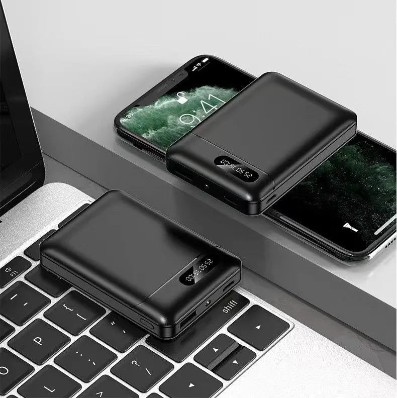 White and black 10000 mAh power bank with multiple USB ports for charging smartphones and tablets