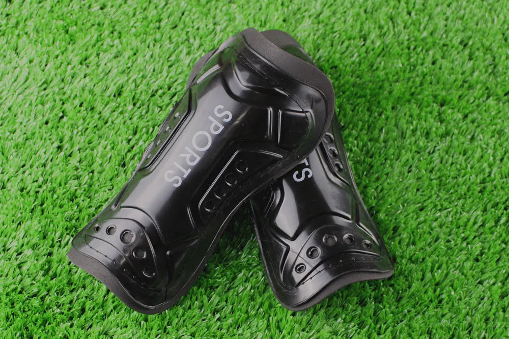 Pair of football shin guards with strap, solid colour, size L 19cm and size S 13.5cm