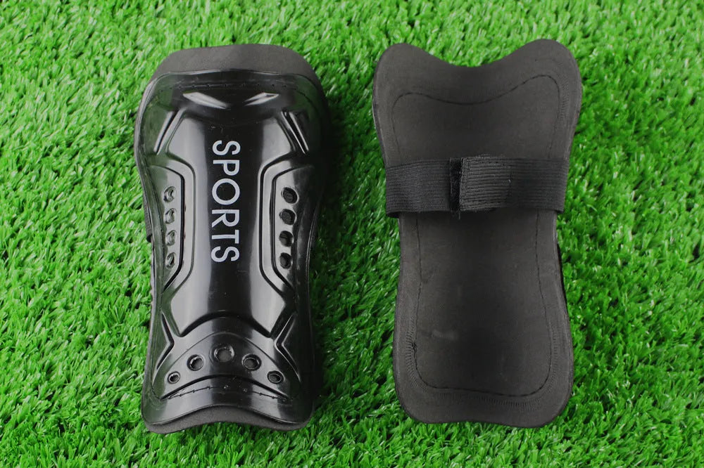 Pair of football shin guards with strap, solid colour, size L 19cm and size S 13.5cm