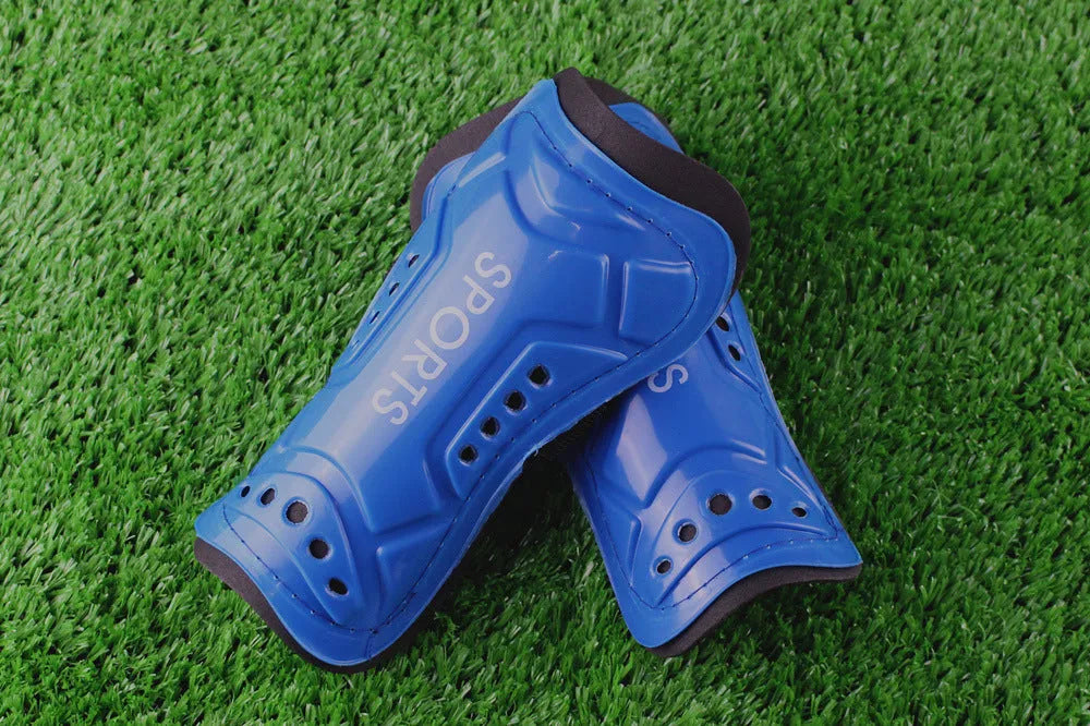 Pair of football shin guards with strap, solid colour, size L 19cm and size S 13.5cm