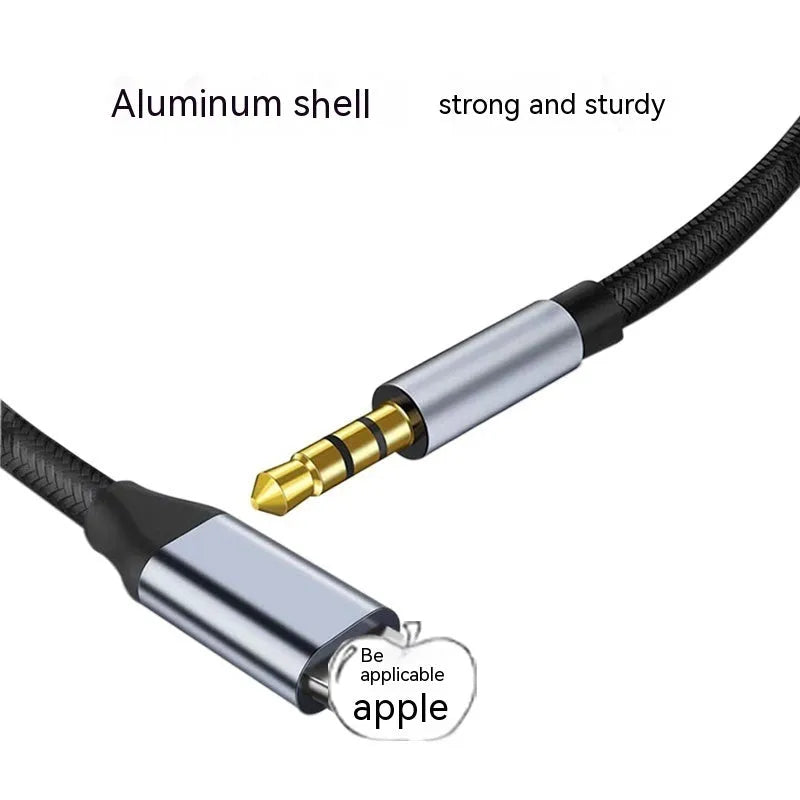 Black braided Lightning to 3.5mm male AUX audio adapter cable on white background