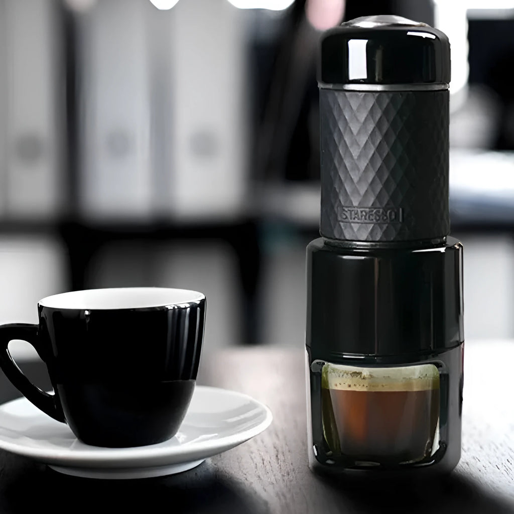 Compact stainless steel portable manual espresso coffee machine in black colour