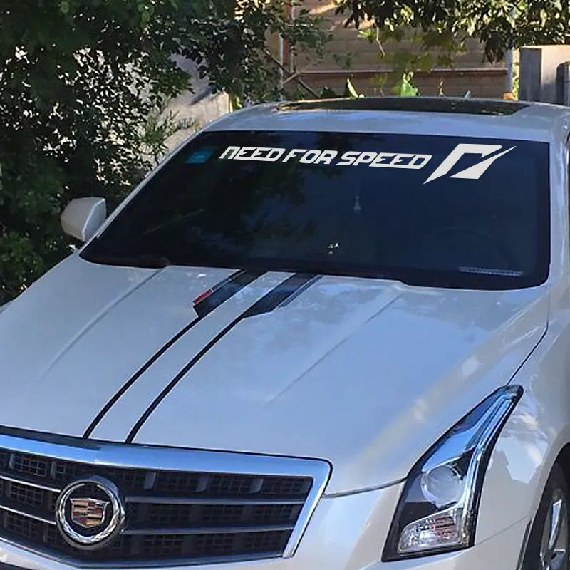 White and rose coloured car sticker examples placed on a vehicle windshield and side window.