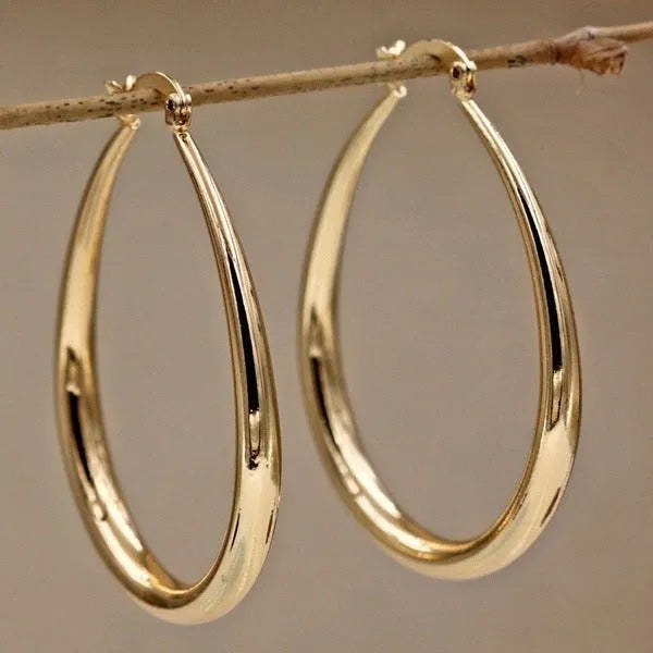 Geometric oval metal earrings for women with electroplated finish and alloy inlaid gems in gold and silver