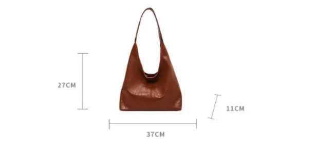 Soft leather large capacity casual shoulder bag with zip closure in multiple colour options.