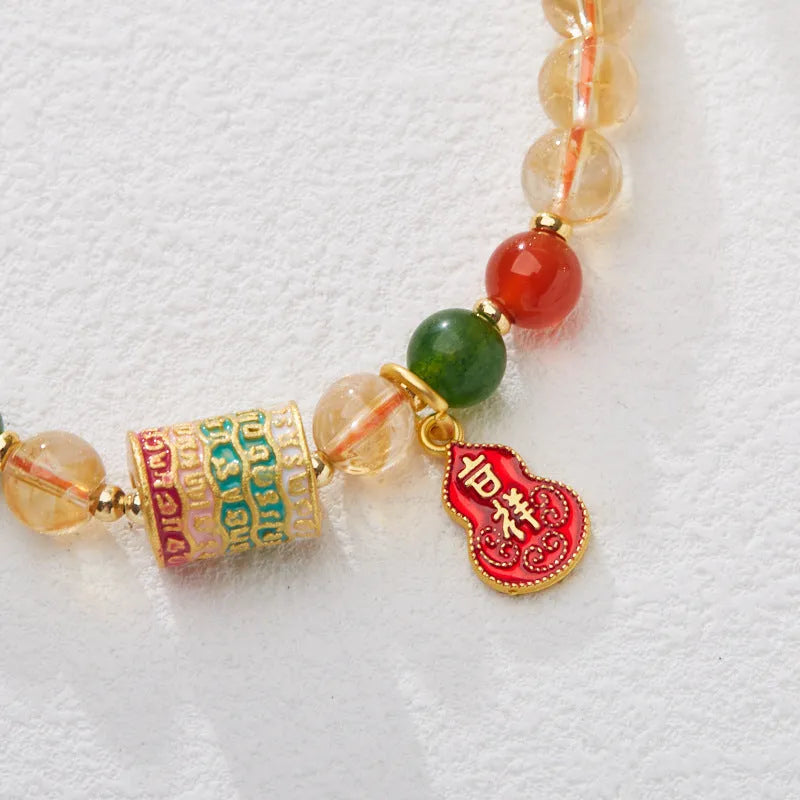 Hand-woven unisex bracelet with 6mm citrine beads in a five-sutra braid design.