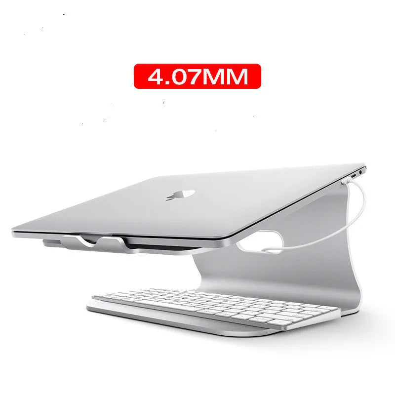 Silver aluminium laptop cooling bracket with striped texture on a wooden desk, rotated at an angle.