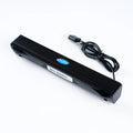 Black USB wired mini speaker for laptop computer with 200x28x27mm size and 900mm cable on a desk