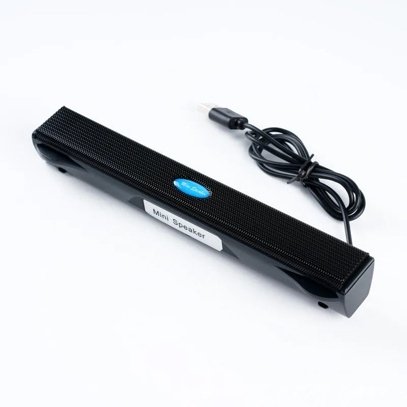 Black USB wired mini speaker for laptop computer with 200x28x27mm size and 900mm cable on a desk
