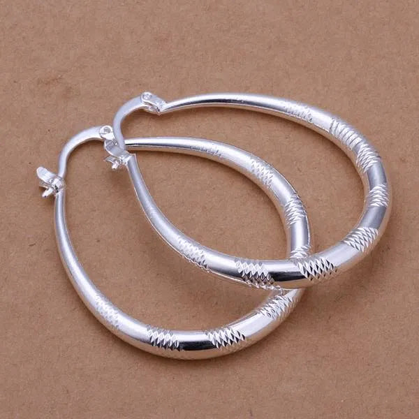Creative silver tone hoop earrings with copper core and 925 silver plating, 3.9cm by 3.2cm