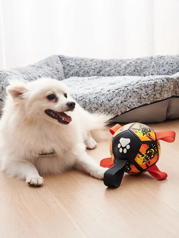 Dog soccer ball toy with straps in Christmas and Halloween colours for tug of war and water play