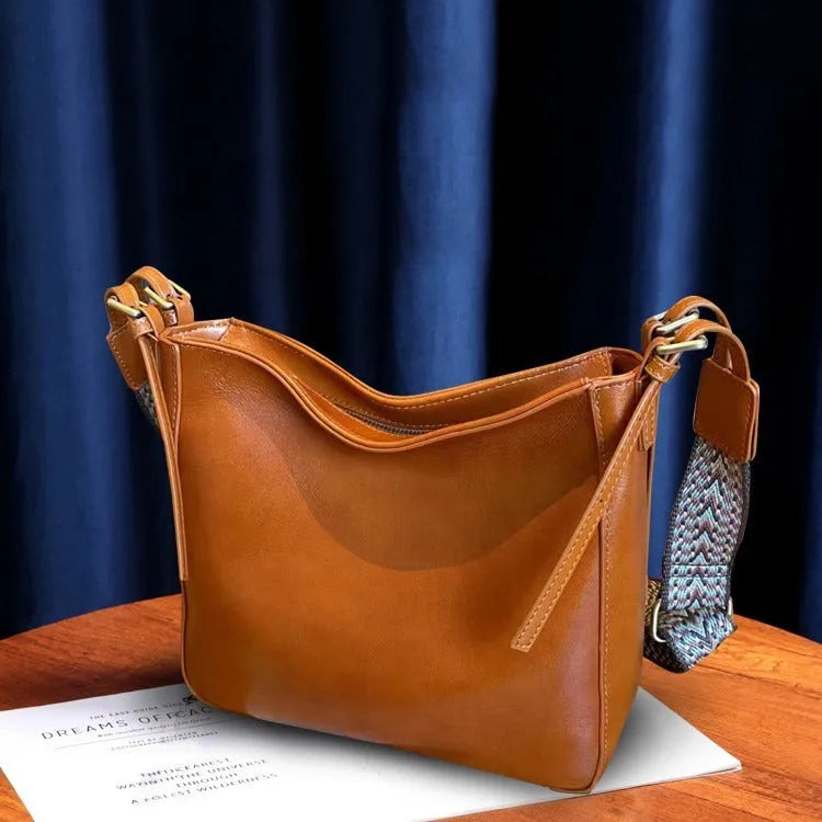 Women's leather shoulder messenger bag in square vertical shape with multiple compartments