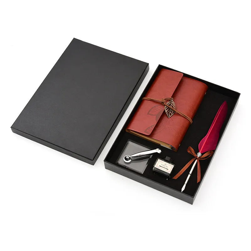 Feather dip pen gift set with copper pen, ink bottle, acrylic base, and antique book in box