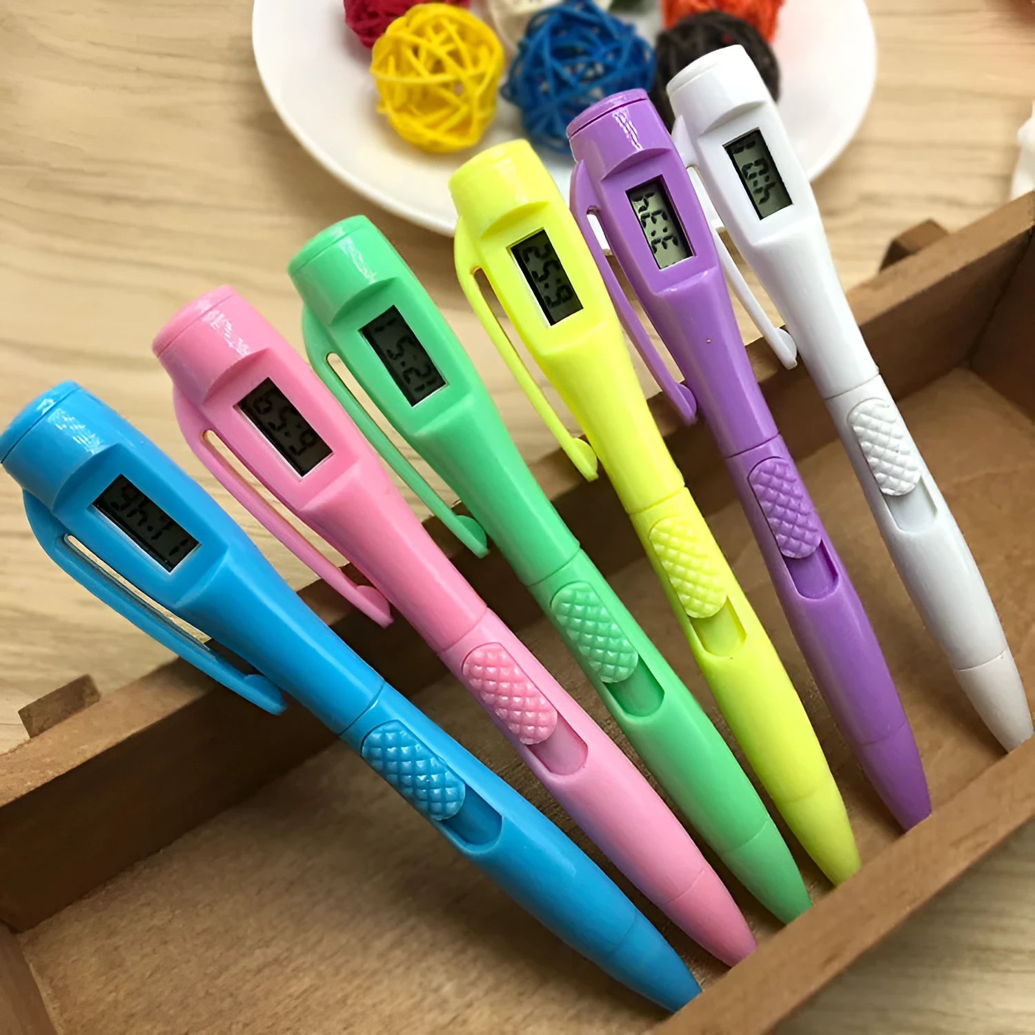Electronic watch test ballpoint pen with plastic shell in a colour option, on a plain background