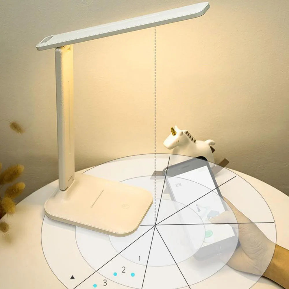 White plastic children's bedside lamp with touch dimming control and USB charging port.