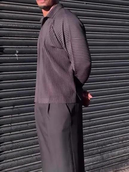 Black men's pleated long-sleeved casual top made from polyester fabric.