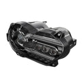 Black background LED motorcycle headlight unit showing front lens and housing.