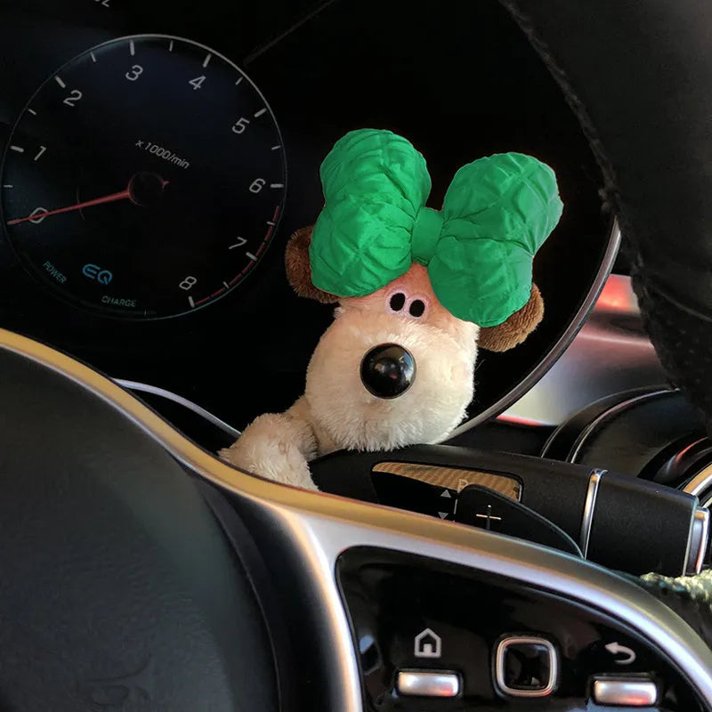 Cute cotton car decoration doll showing a pilot dog design on a dashboard.