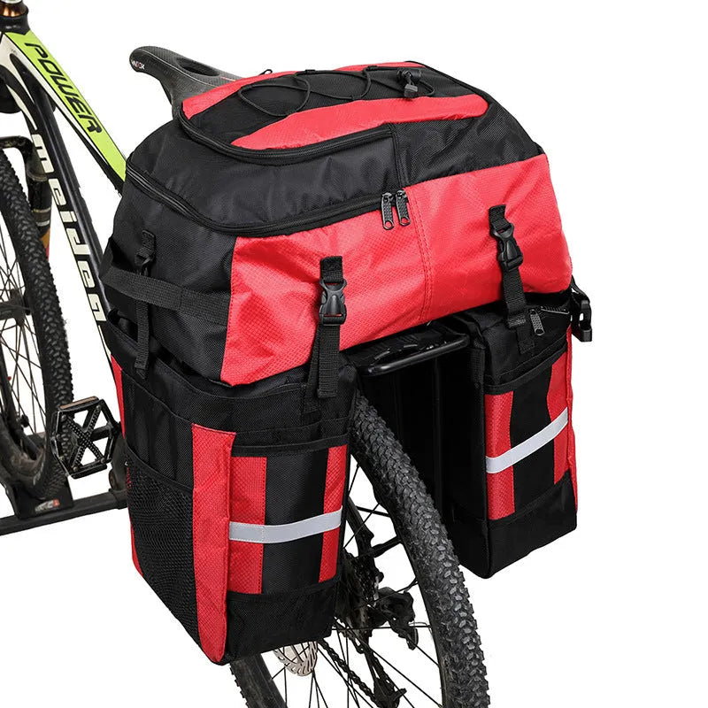 Rhinoceros large green bicycle rear pannier bag mounted on a bike rack for touring.