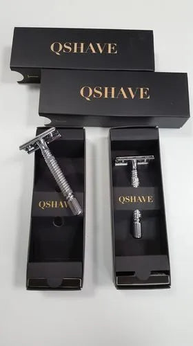 Double edged safety razor with stainless steel handle and metal storage box.