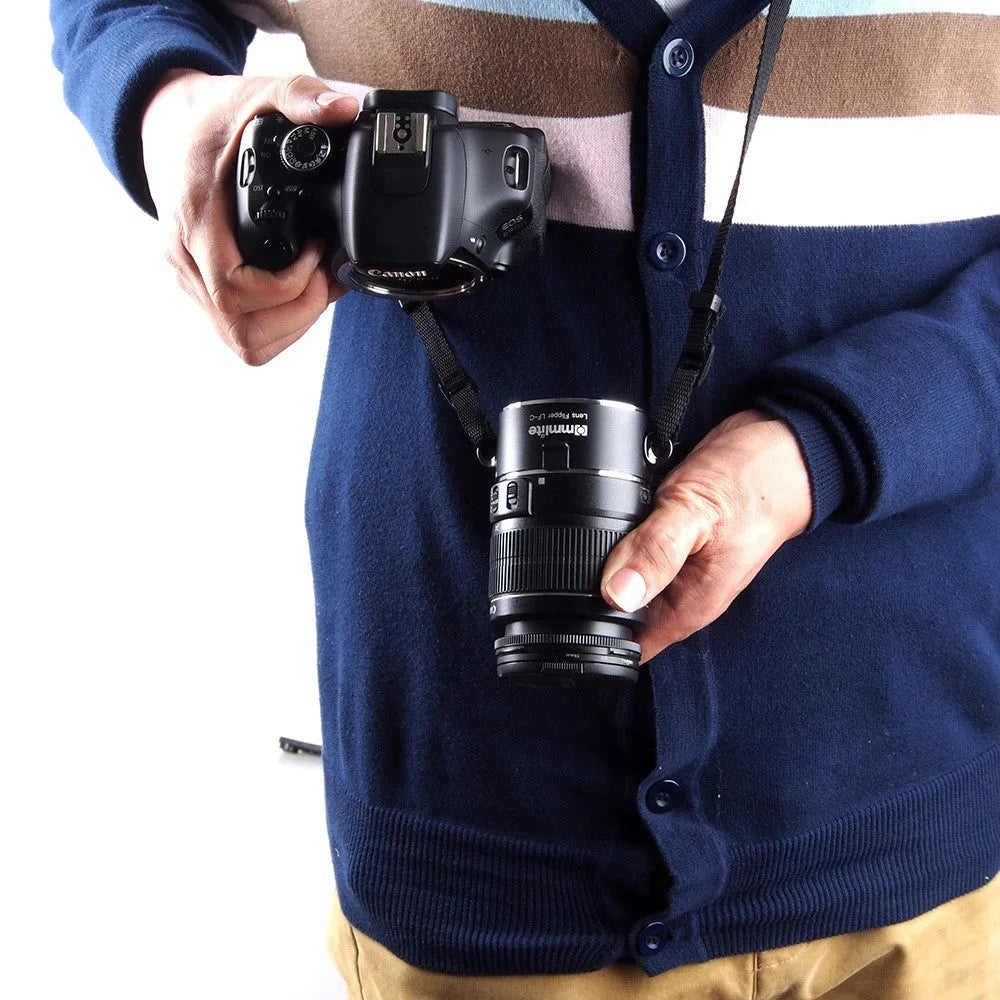 Aluminium camera lens flipper holder with cotton shoulder strap for quick lens changes on Nikon, Canon, or Sony cameras.