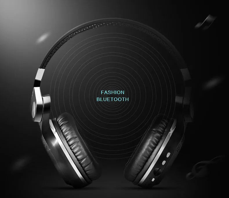 Compact card-sized Bluetooth headset in black colour with head-mounted earpieces, shown on a white background.