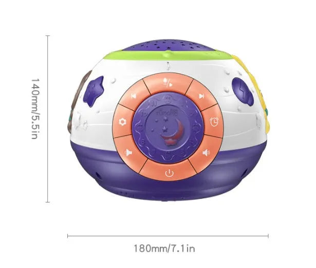 White plastic starry sky night light projector for children on a table, projecting blue stars onto a wall.