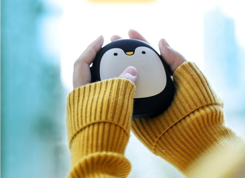 Cartoon penguin and polar bear design USB rechargeable hand warmer showing front and back.