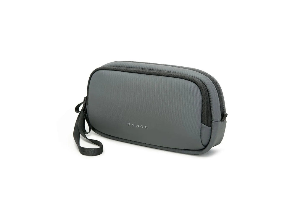Large capacity digital accessories storage bag in black with sewing line detailing on a plain background