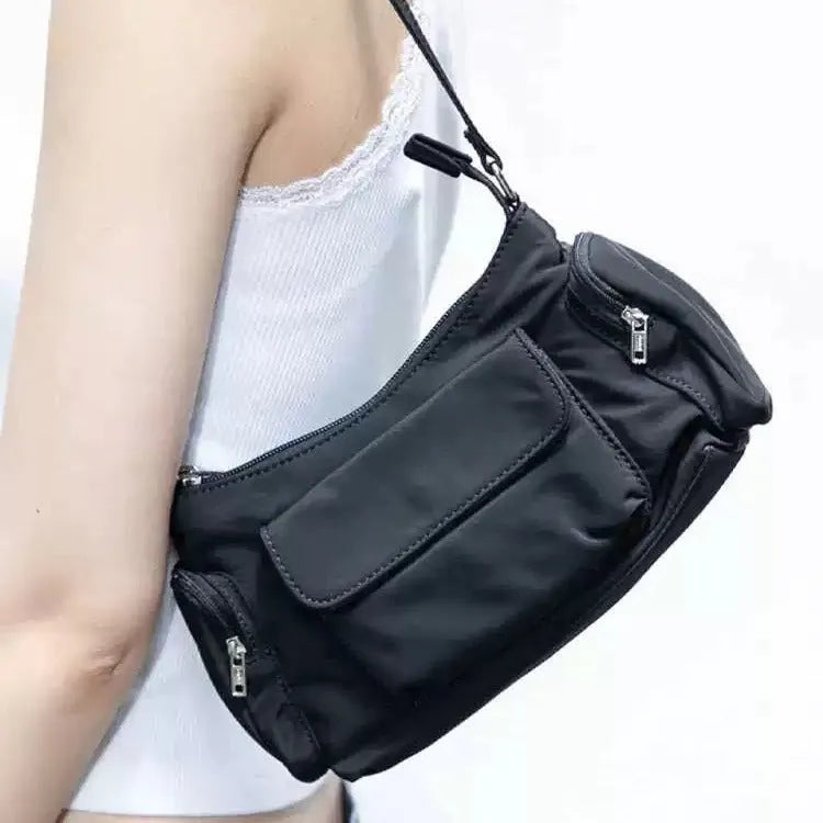 Black PU nylon women's shoulder bag with two pockets and side line detail showing dimensions