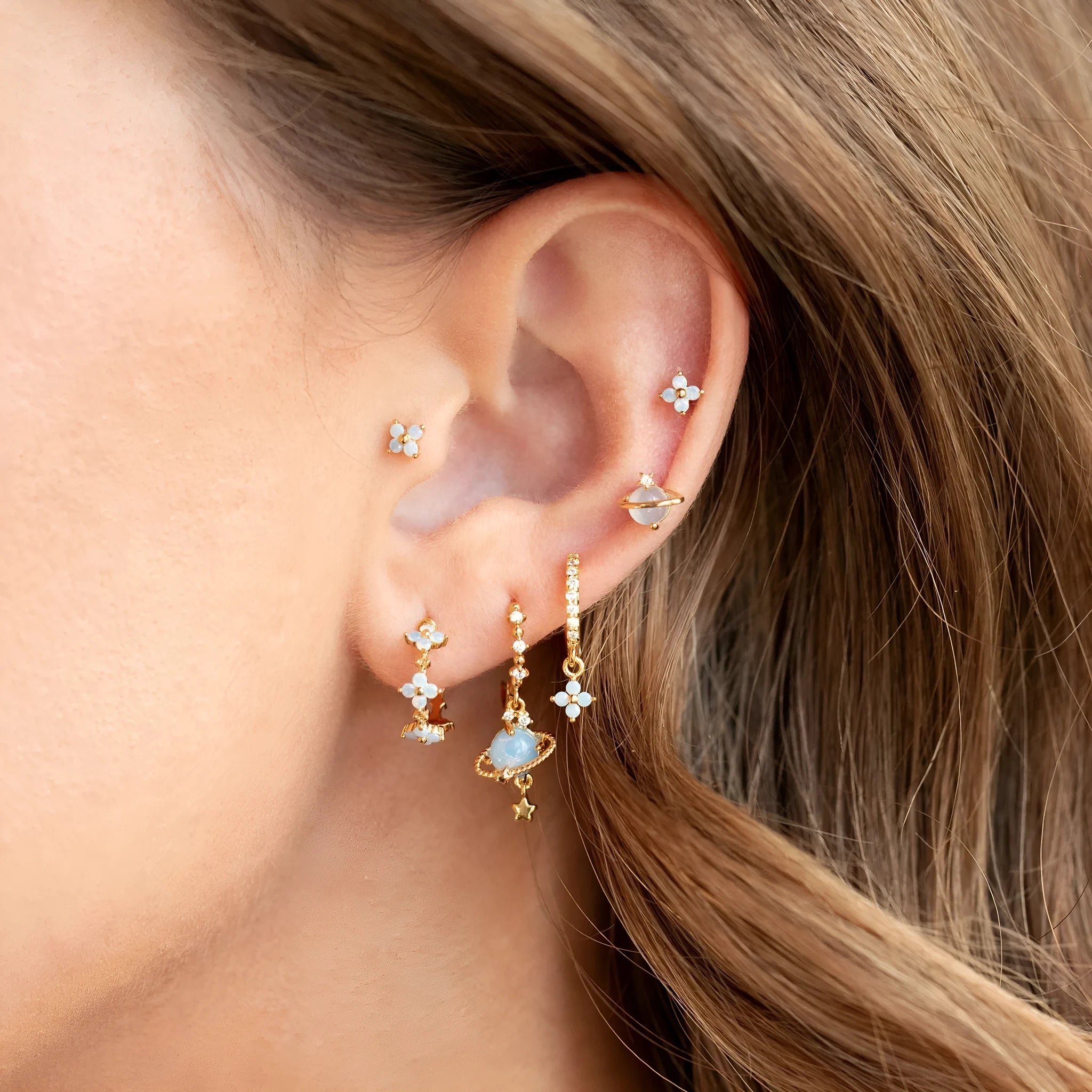 Gold and silver floral ear studs with zircon mosaic details in Japanese Korean style.