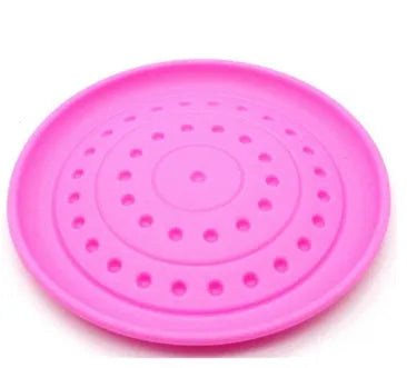 Plastic dog Frisbee disc in green colour, large size, for outdoor fetching and chewing.