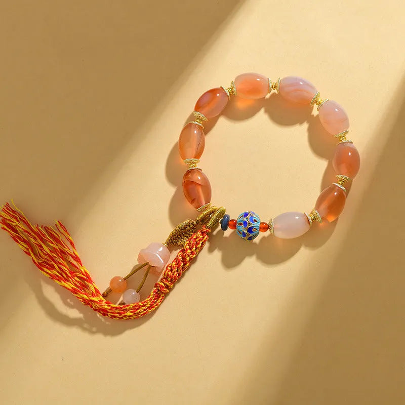 Vintage Tibetan agate bracelet with floral and geometric patterns including lily motif