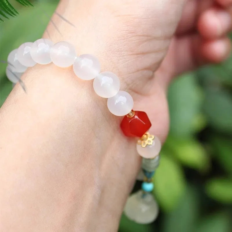 Hand-woven Agate lotus seedpod bracelet with Tian Shan Cui beads in geometric pattern