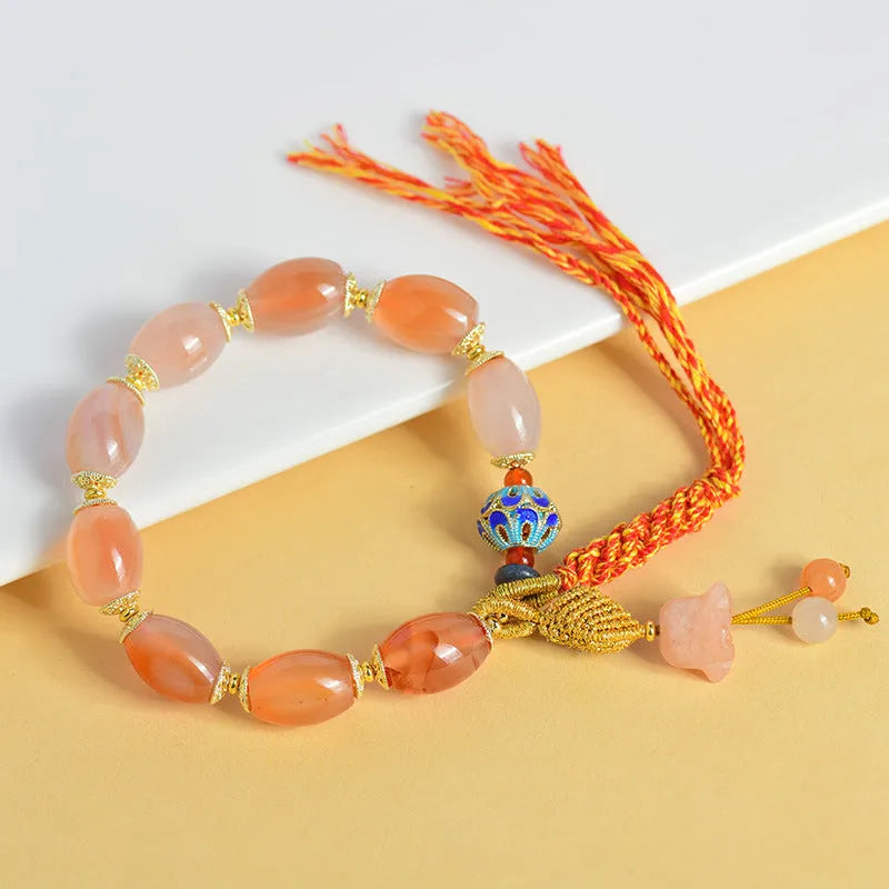 Vintage Tibetan agate bracelet with floral and geometric patterns including lily motif