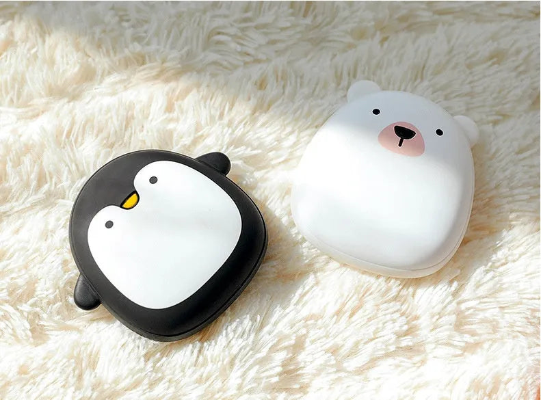 Cartoon penguin and polar bear design USB rechargeable hand warmer showing front and back.