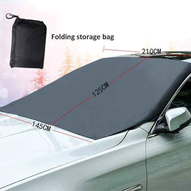 Black rubber Oxford cloth windshield ice and snow gown draped over car windscreen in winter