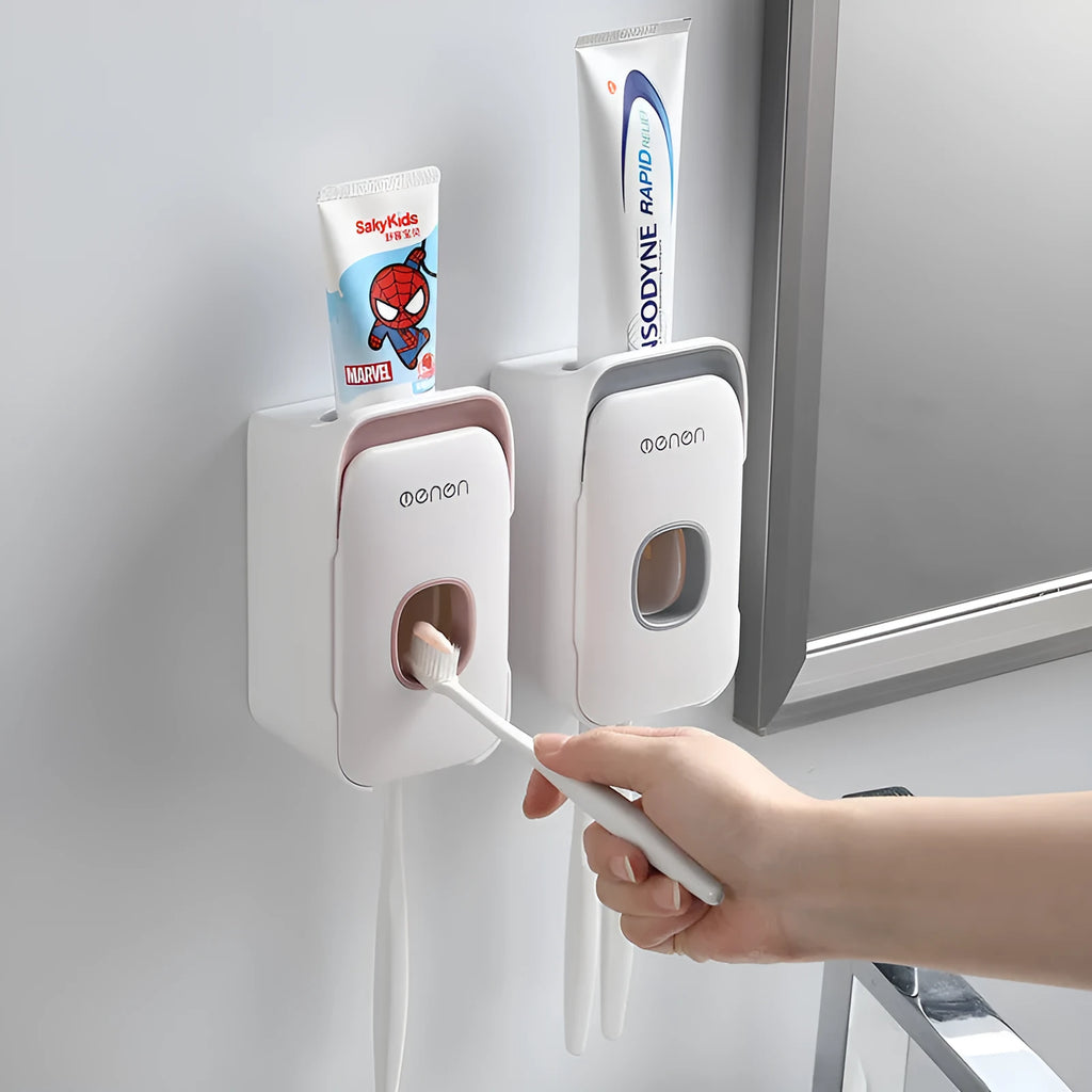 Automatic toothpaste dispenser in blue colour mounted on a bathroom wall