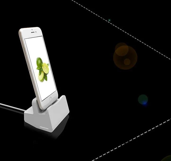 White minimalist headphone charging base on a desk or table