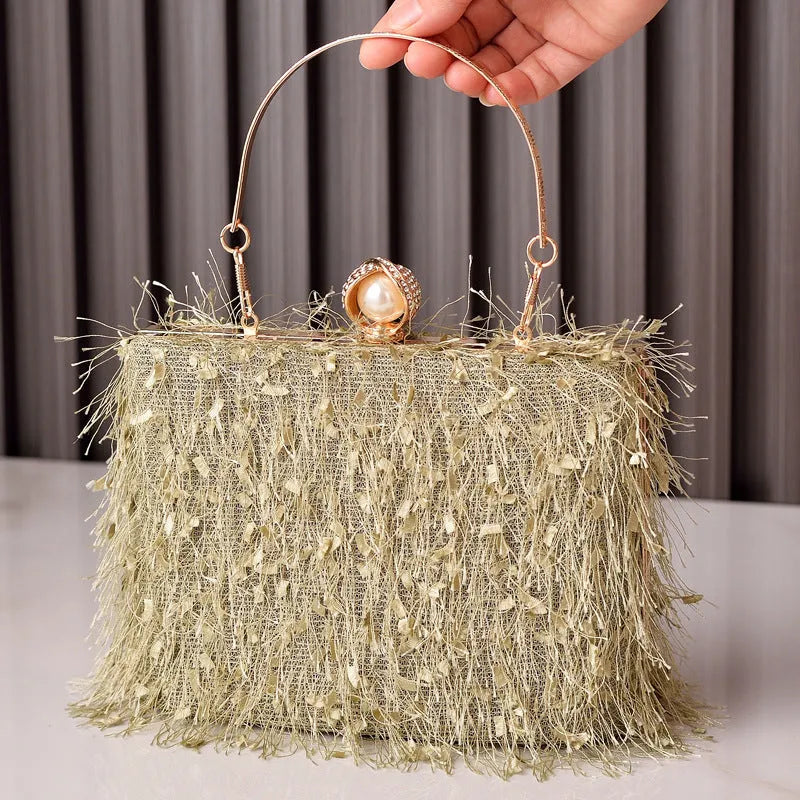Tassel handbag for women with lock closure and tassel detail, cylinder shape, available in multiple colours